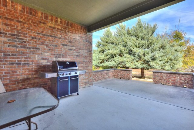 view of patio featuring a grill