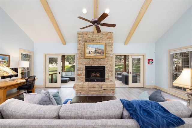 living room featuring french doors, high vaulted ceiling, and light hardwood / wood-style flooring