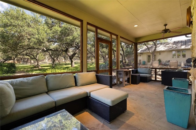 sunroom / solarium with ceiling fan