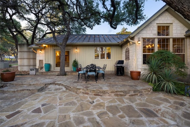 back of property with a patio area