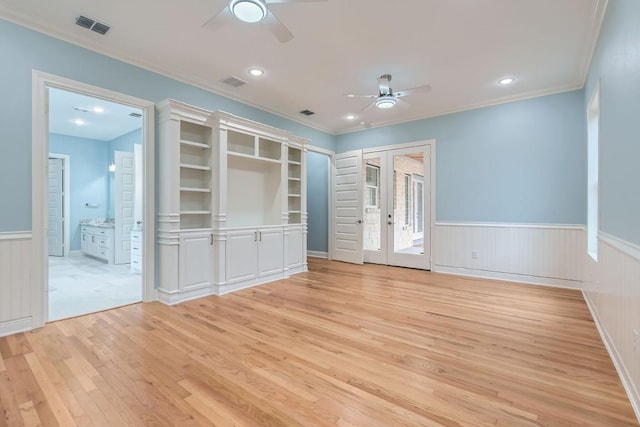 205 Vitex Dr, Lakeway, TX 78734 - unfurnished bedroom featuring light wood-type flooring, wainscoting, ornamental molding, access to exterior, and french doors