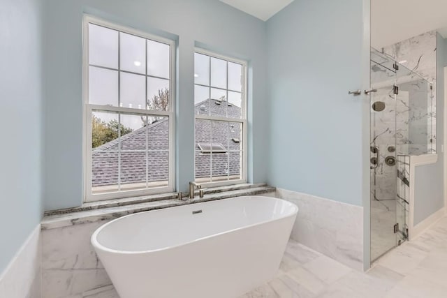 205 Vitex Dr, Lakeway, TX 78734 - full bath with marble tiled floors, a freestanding bath, a marble finish shower, and a wainscoted wall