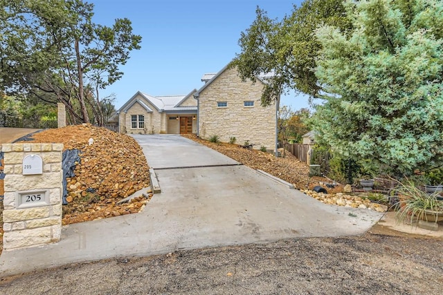 205 Vitex Dr, Lakeway, TX 78734 - view of front of home with stone siding and driveway