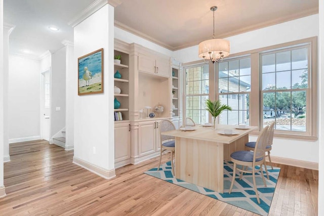 205 Vitex Dr, Lakeway, TX 78734 - dining space with baseboards, crown molding, light wood-style floors, stairway, and a chandelier