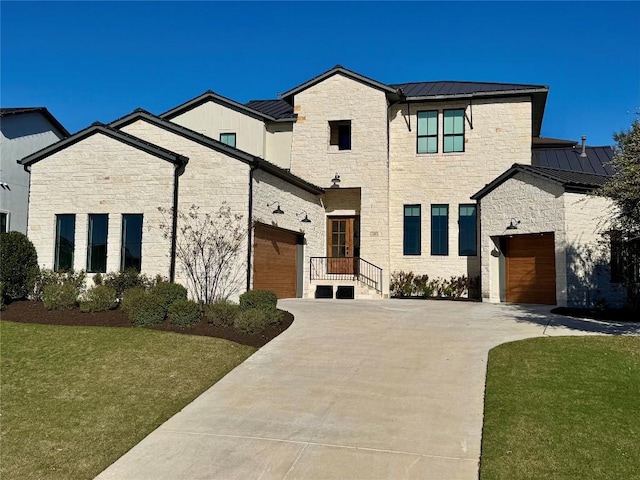 view of front of house with a garage and a front lawn