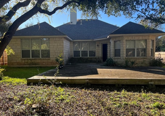 back of house with a wooden deck