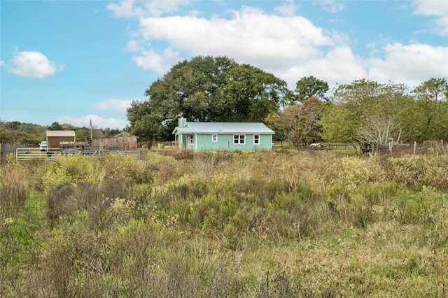 view of yard with a rural view