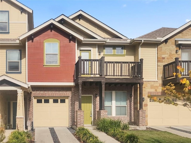 townhome / multi-family property featuring a garage and a balcony