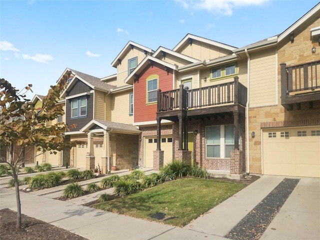 view of front of house featuring a balcony and a front lawn