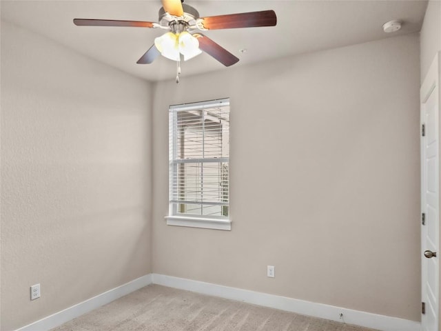 unfurnished room with light carpet and ceiling fan