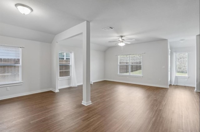 unfurnished living room with lofted ceiling, ceiling fan, and dark wood-type flooring