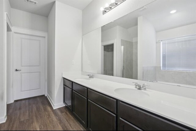 bathroom featuring hardwood / wood-style floors and vanity