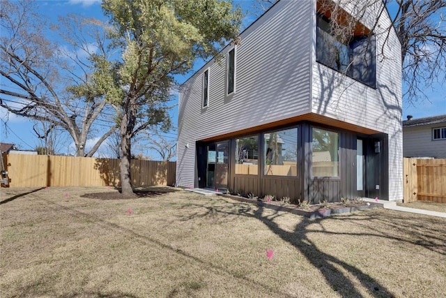 rear view of property with fence