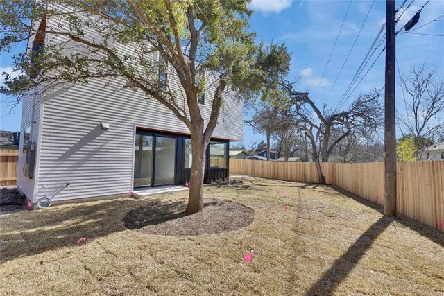 view of yard with a fenced backyard