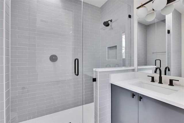 full bathroom featuring vanity and a stall shower