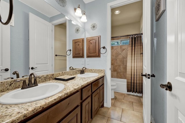 full bathroom with toilet, vanity, tile patterned floors, and shower / bathtub combination with curtain