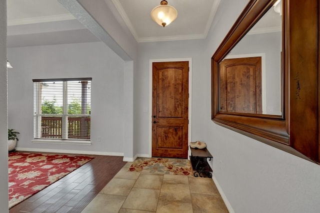 entryway with hardwood / wood-style floors and ornamental molding