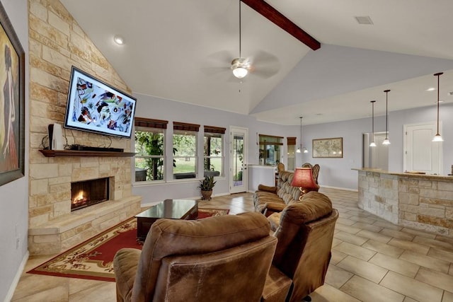 living room with ceiling fan, high vaulted ceiling, beamed ceiling, a fireplace, and light tile patterned floors