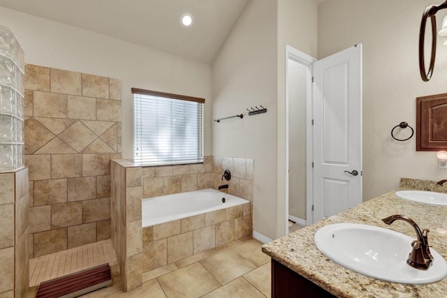 bathroom featuring tile patterned flooring, vanity, vaulted ceiling, and shower with separate bathtub