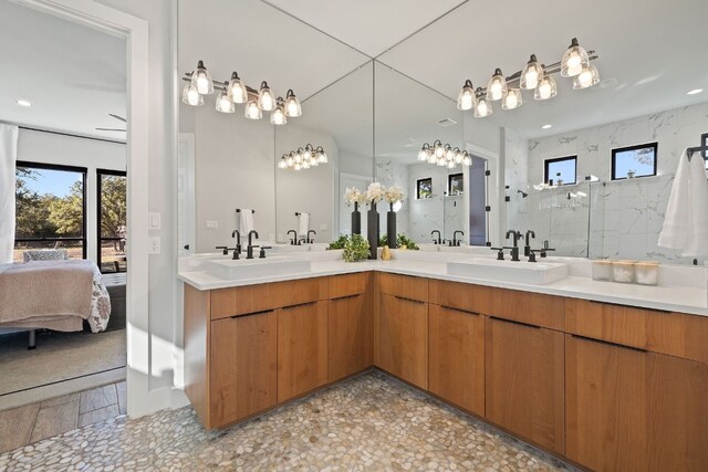 bathroom with vanity and a shower