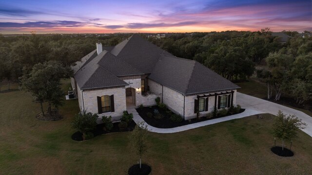 view of front of property with a lawn