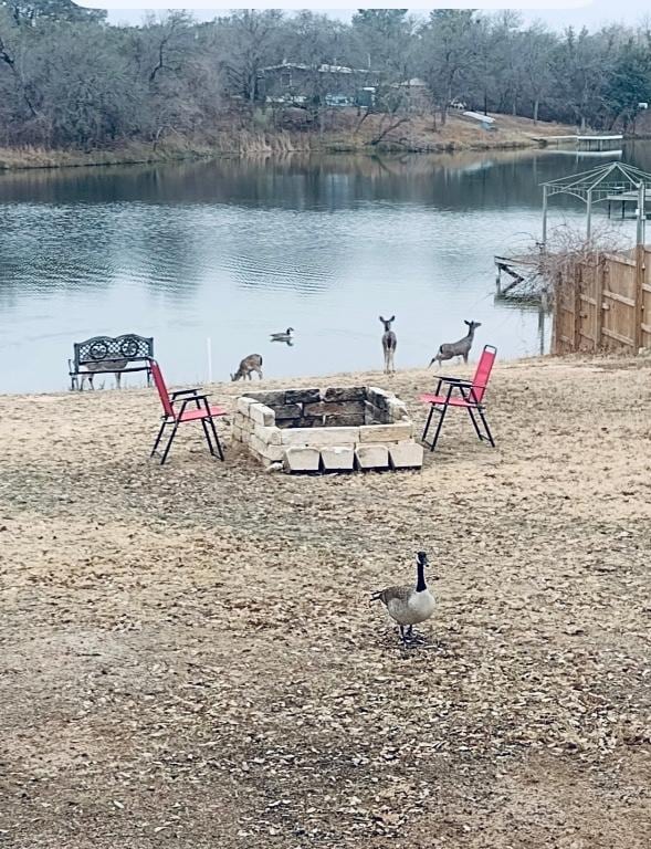 1342 Moose Trl, Kingsland, TX 78639 - water view with an outdoor fire pit