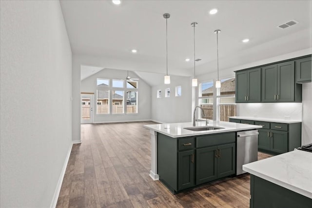 kitchen with ceiling fan, sink, dark wood-type flooring, stainless steel dishwasher, and pendant lighting