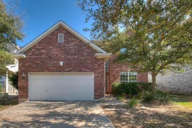 front facade with a garage