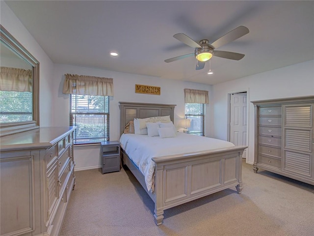 carpeted bedroom with ceiling fan