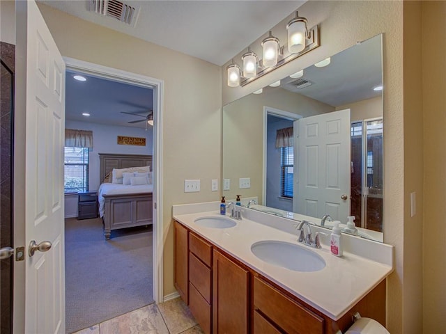 bathroom with ceiling fan and vanity