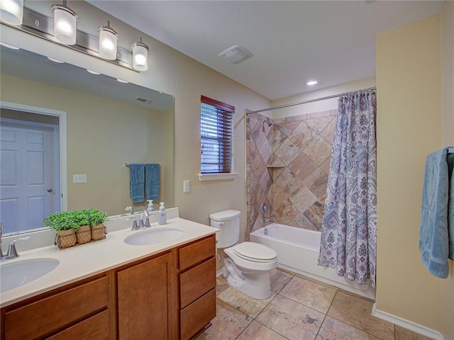 full bathroom with toilet, tile patterned floors, vanity, and shower / tub combo with curtain