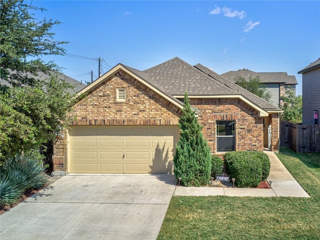 front facade featuring a garage and a front lawn