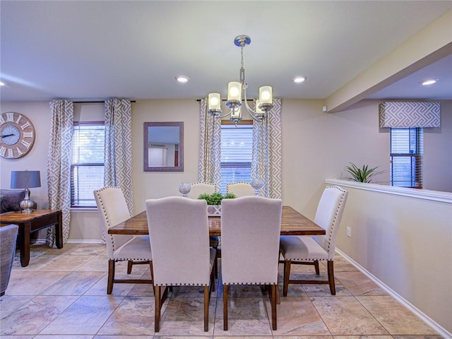 dining room with a notable chandelier