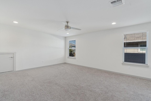 spare room with carpet and ceiling fan