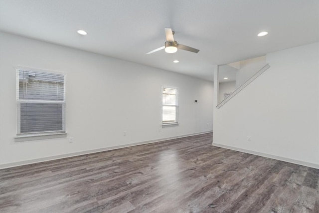 spare room featuring ceiling fan and hardwood / wood-style flooring