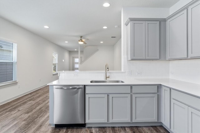 10400 Fulton Ave, Austin, TX 78754 - kitchen with stainless steel dishwasher, a sink, gray cabinets, a peninsula, and recessed lighting