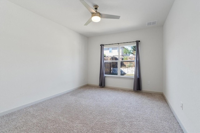 10400 Fulton Ave, Austin, TX 78754 - empty room featuring light colored carpet, ceiling fan, and baseboards