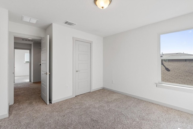 unfurnished bedroom with carpet and a closet