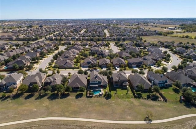 birds eye view of property with a residential view