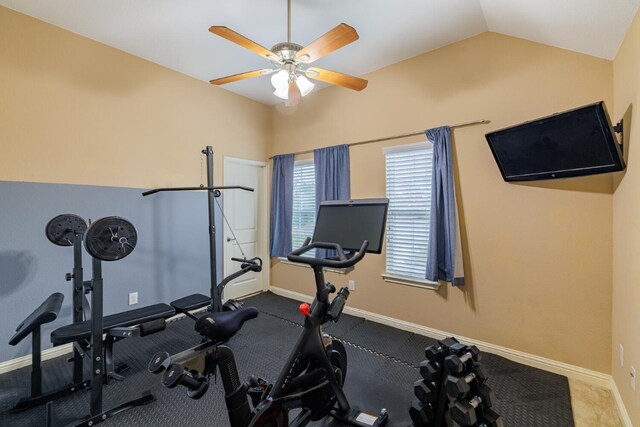 exercise room with lofted ceiling, carpet floors, and ceiling fan