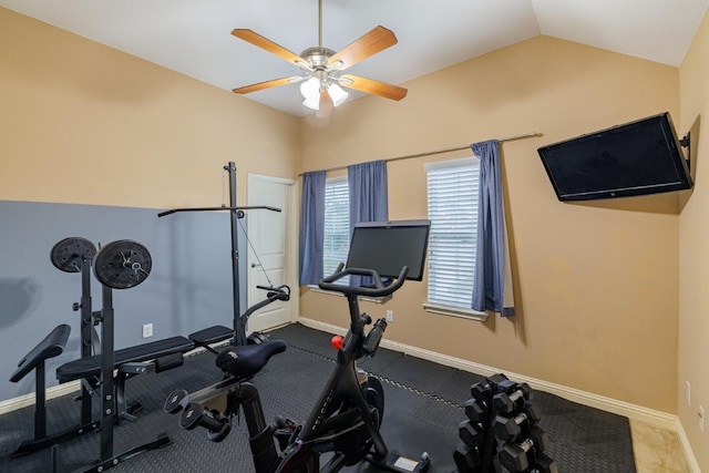 workout area with vaulted ceiling, baseboards, and ceiling fan