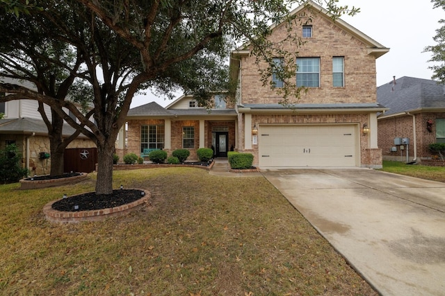 traditional-style home featuring brick siding, a garage, driveway, and a front lawn