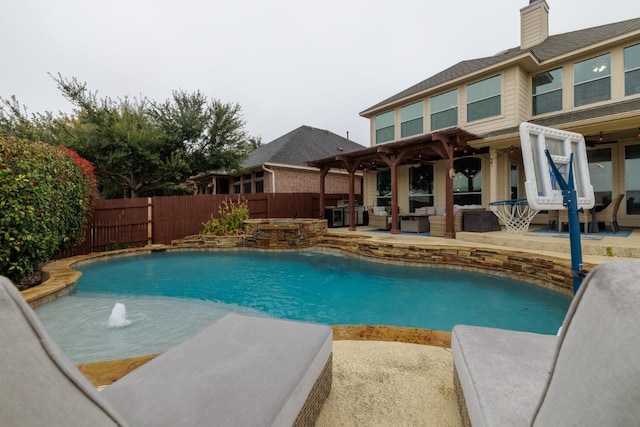 view of pool with a patio area, a fenced backyard, a fenced in pool, and an in ground hot tub