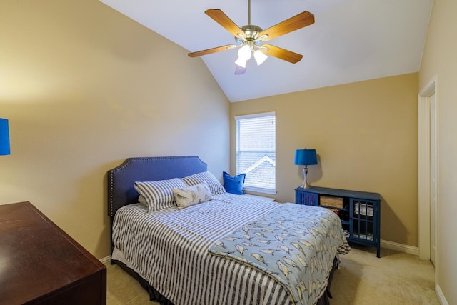 bedroom featuring lofted ceiling, light colored carpet, and ceiling fan