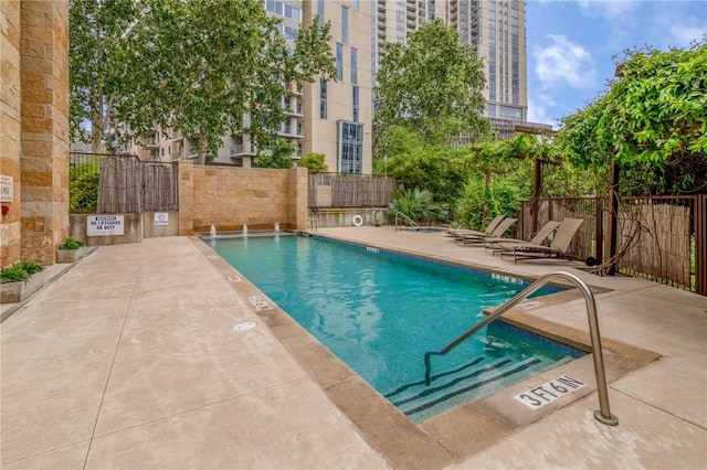 view of swimming pool with a patio