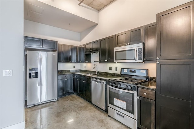 kitchen featuring dark brown cabinets, sink, and stainless steel appliances