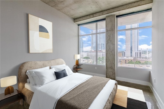 bedroom featuring hardwood / wood-style floors and multiple windows