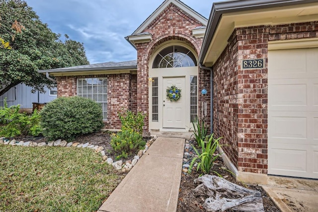 doorway to property featuring a garage