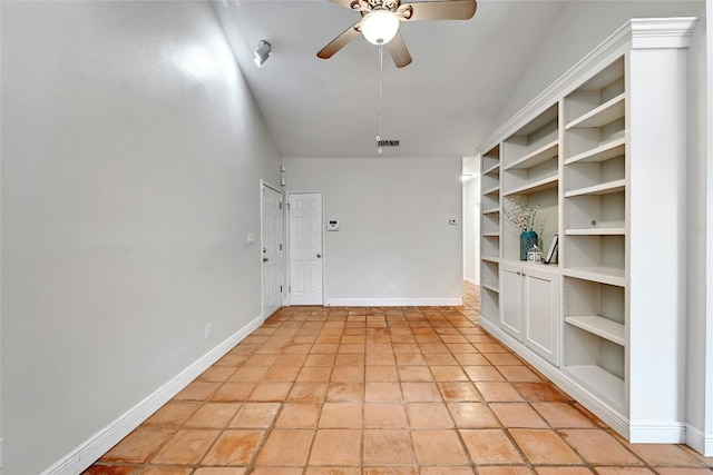 tiled spare room with ceiling fan and lofted ceiling