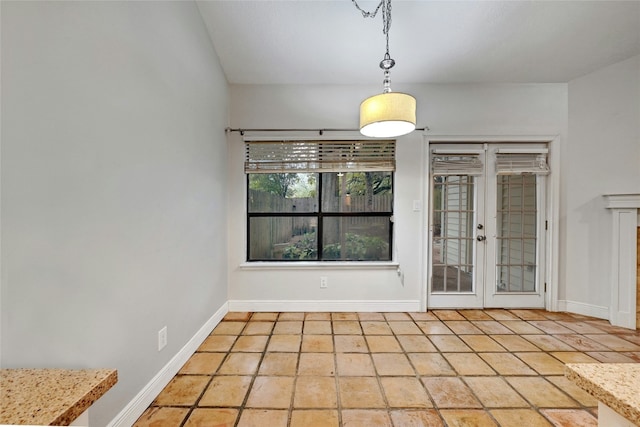 unfurnished dining area with french doors